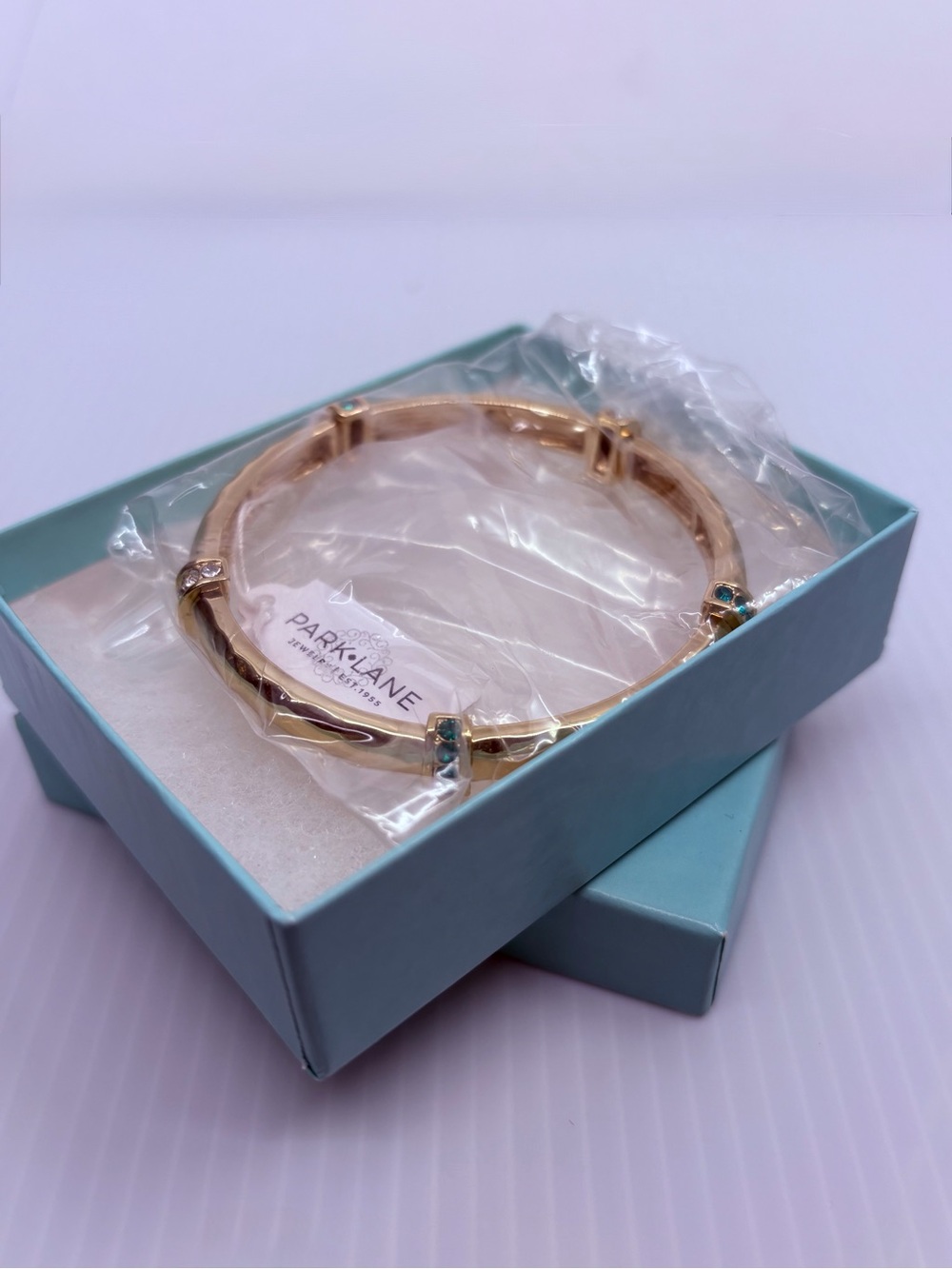 Park Lane Gold Bracelet with Aquamarine Accent Stones